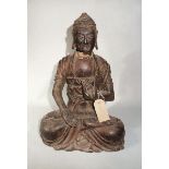 A Chinese carved wood seated figure of a Buddha, in Song Dynasty style