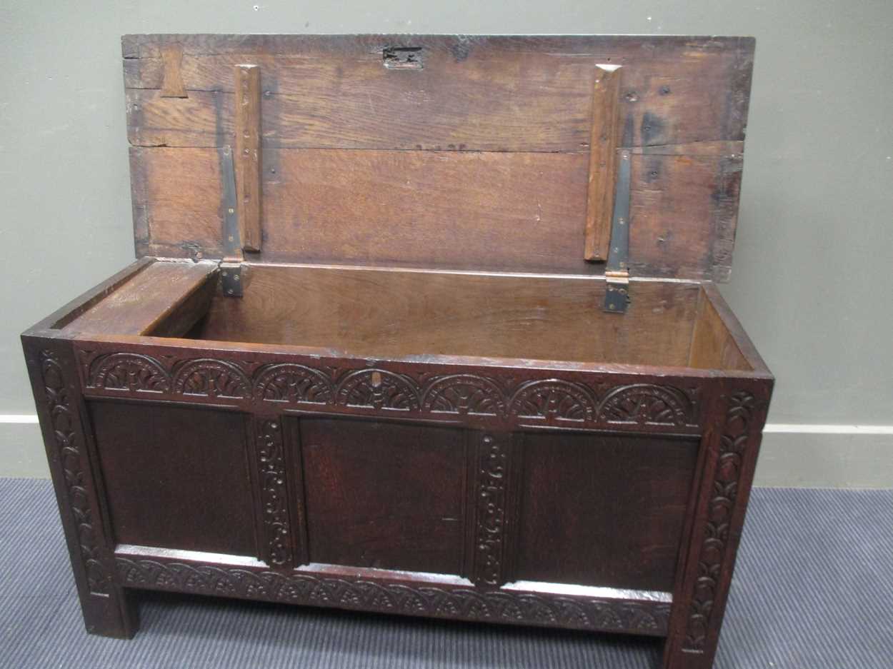 An 18th century three panel coffer with carved front decoration and internal candle box with lid - Image 2 of 8