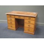 A pine pedestal desk, with leather top over three freize drawers and a further three drawers in each