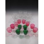 Eight cranberry glasses, four in green, and various Val St Lambert wine glasses