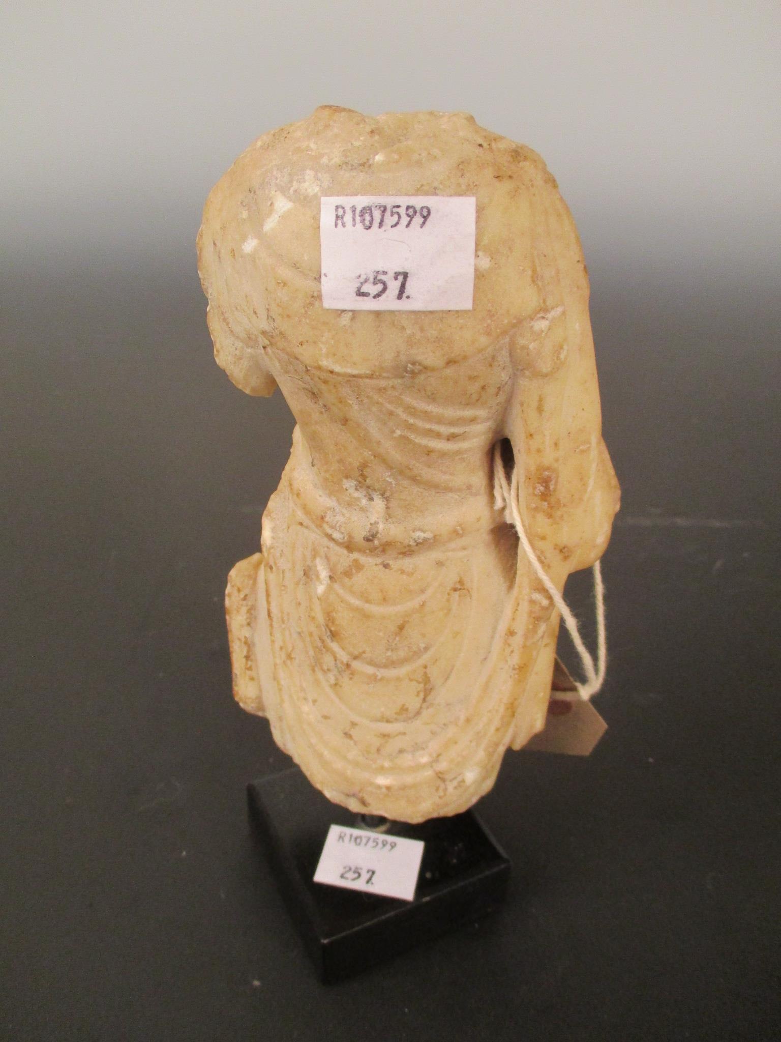 A Chinese white marble fragmentary torso of a Buddhist deity, in Sui Dynasty style, 14cm high - Image 2 of 2