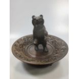 A carved walnut 'musical' bowl, probably Black Forest, and a carved model bear