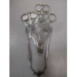 3 pairs of silver tea tongs and a pair of sprung loaded silver sugar nips (4)