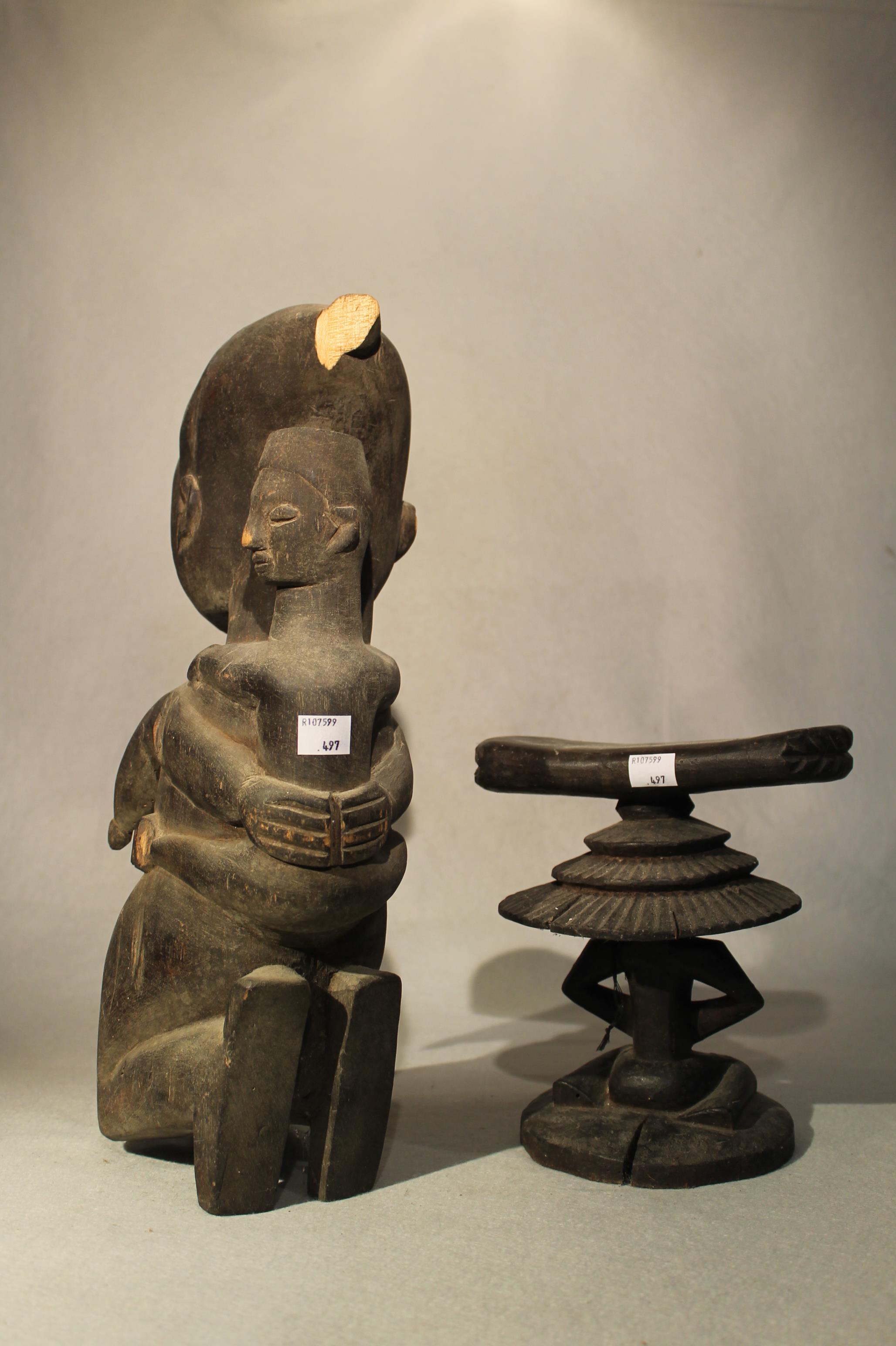 A Baluba wood headrest, with stylized kneeling figure with stepped fan coiffure, 21cm high; an Ibo - Image 2 of 5