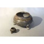 Two Chinese green puddingstone plain compressed ovoid tripod bowls, perhaps Tang Dynasty, the