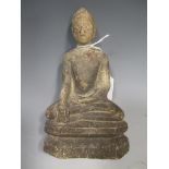 A Thai carved soft-stone Buddha, seated in meditation, on a chamfered integral base, 19th/20th