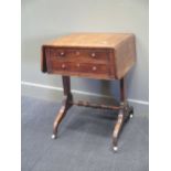 A Regency mahogany work table, the frieze drawer with tooled burgundy leather writing slope, on