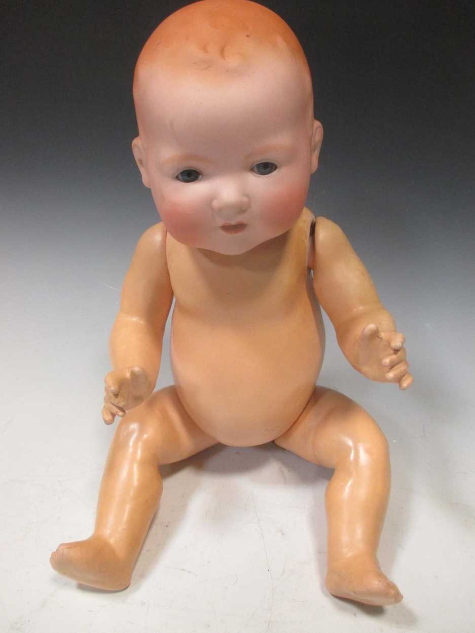An Armand Marseille Dream Baby bisque headed doll, marked 351/8K, jointed composition body, 50cm