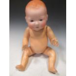 An Armand Marseille Dream Baby bisque headed doll, marked 351/8K, jointed composition body, 50cm