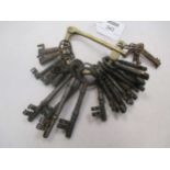 A collection of vintage keys on brass hasp