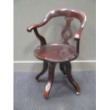 A Victorian mahogany revolving desk chair