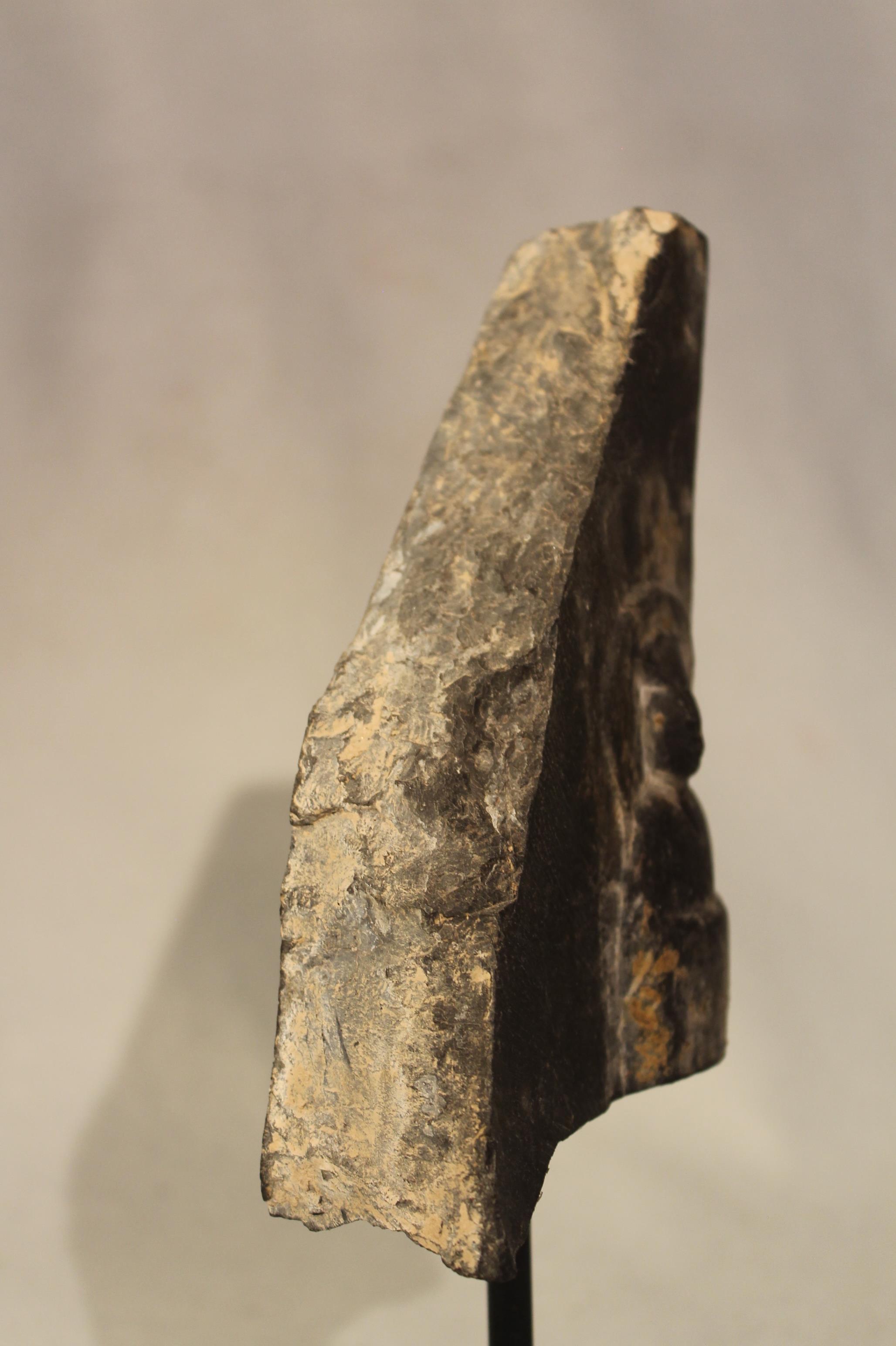 A Chinese black stone stele fragment carved with a Buddhist disciple, in Wei Dynasty style, 17.5cm - Image 2 of 3