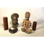 A group of African pottery including Cameroon items, comprising two smoking pipes, 18cm and 10 cm