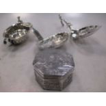 A Continental metalwares 'cherub' decorated box, 2 small ladles, and a small feeding cup (4)