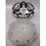 A Worcester style bird decorated plate (restored) 24.5cm diam, and a Staffs saltglaze dish (a/f)