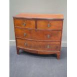 A mahogany bowfronted chest of two short and two long drawers, early 19th century 91 x 101 x