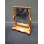 A dressing table mirror 54cm wide together with a wall mirror 82 x 56cm (2)