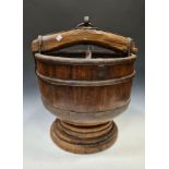 A Chinese carved wood and metal mounted well bucket, 19/early 20th century