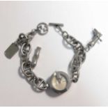 A ladies Gucci G watch, charm bracelet model 107 with attached charms including a boot