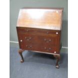 A 20th century mahogany veneered bureau 103 x 76 x 44cm and a reproduction serpentine fronted