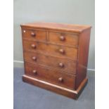 A Victorian mahogany chest of drawers with turned knob handles and Bramah locks, on plinth base