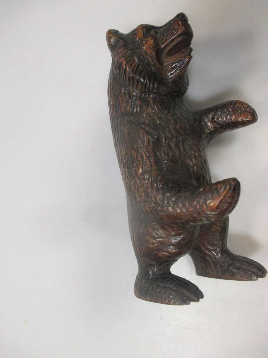 A carved walnut 'musical' bowl, probably Black Forest, and a carved model bear - Image 4 of 9