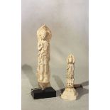 A Chinese stucco figure of Guanyin standing, 19cm high, and another, 12cm high, both in 6th