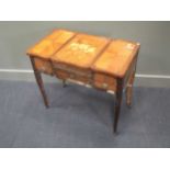 A French early 19th century kingwood and inlaid dressing table with three compartments, the