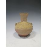A Chinese olive glazed pottery Hu jar, Han Dynasty, with shoulder lugs and line incised detail, 15cm