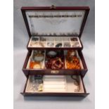 A jewellery box containing a quantity of costume jewellery