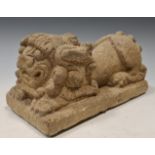 A Chinese carved grey- stone crouched Fo dog, perhaps 19th century, on integral plinth, 11 x 22cm