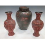 A pair of cinnabar lacquer vases and a lacquer jar and cover