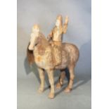 A Chinese red pottery horse with rider up, Han Dynasty type, 31.5cm high