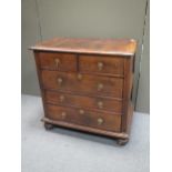 An 18th century walnut chest, possibly continental, with crossbanded top in two sections fitted