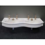 A double sink with brass taps, 120cm wide