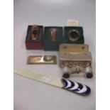 Three novelty modern glass viewers, pair of opera glasses and an enamel handle letter opener