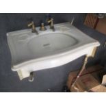 A Bolding 'Simplex' wash basin with brass taps on brass and copper supports, 81cms wide A/F