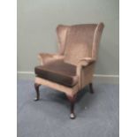 A modern Parker Knoll wing armchair