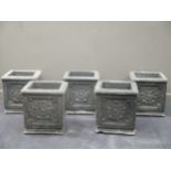 A set of five painted concrete planters with rosette decoration, 40cm square.