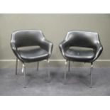 A pair of 20th century black leatherette armchairs (2)