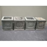 A set of four painted concrete planters with rosette decoration, 40cm square.