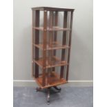 A large four tier stained wood revolving bookcase, with makers plate 'Curt Matthias Leipzig no. 834'