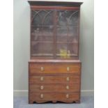 A George III mahogany secretaire bookcase, the upper part enclosed by astragal tracery glazed doors,