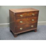 An early 19th century mahogany and elm chest of three long drawers on bracket feet 77 x 84 x 43cm