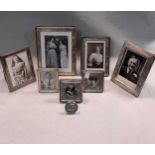 A collection of 8 silver fronted photograph frames (8)