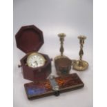 Various brassware including candlesticks, a tie press, Bulova clock in box, etc