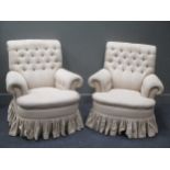 A pair of Howard style deep modern easy armchairs