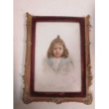 A portrait miniature of a young girl on opaque glass panel signed Foignet, possibly polychrome