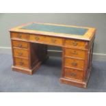 An Edwardian pitch pine pedestal desk 137cm wide