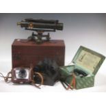 A Charles Baker, London, surveyor's level, no.3822, boxed with tripod and staff; a pair of